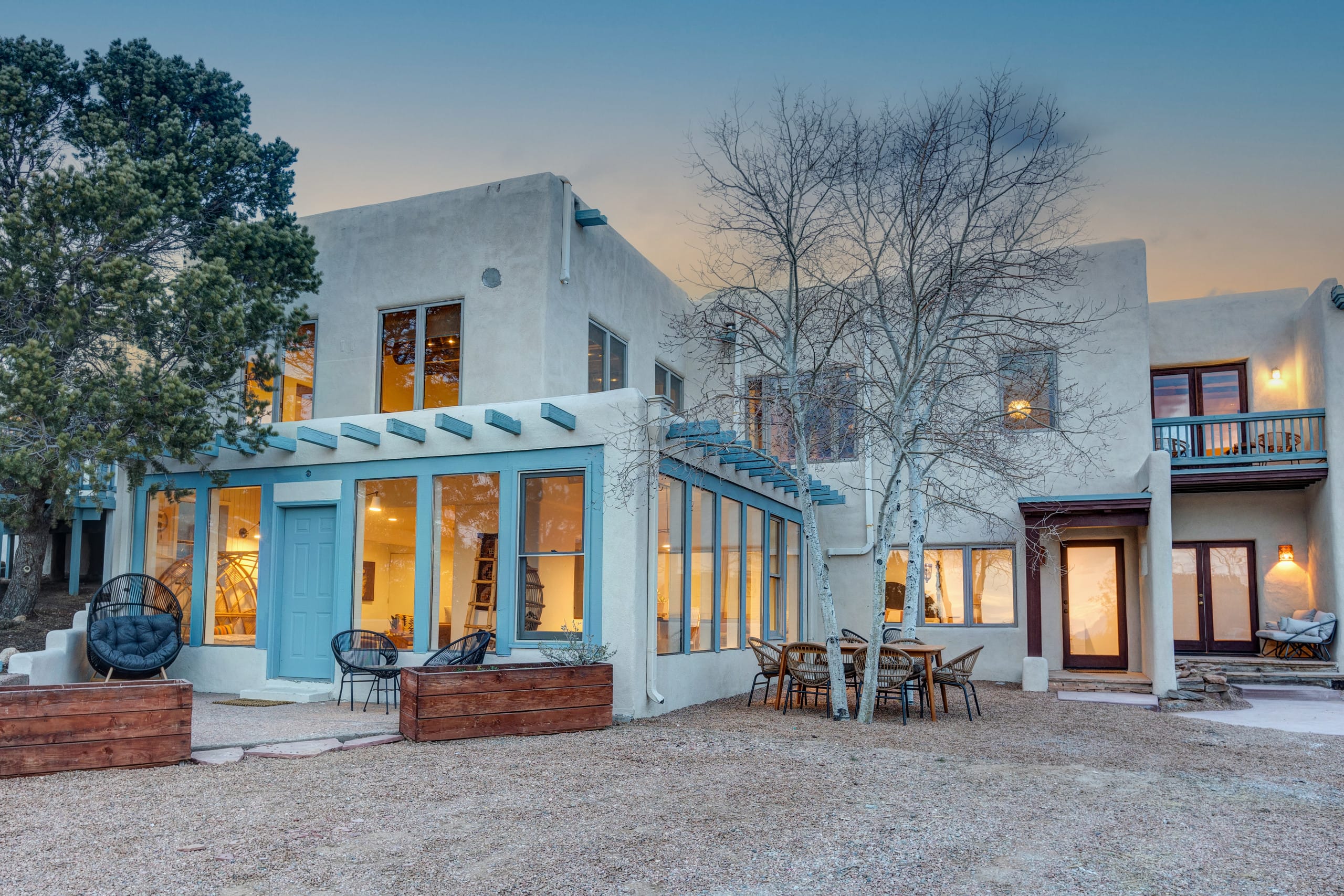 Casa de Camino exterior glowing at dusk