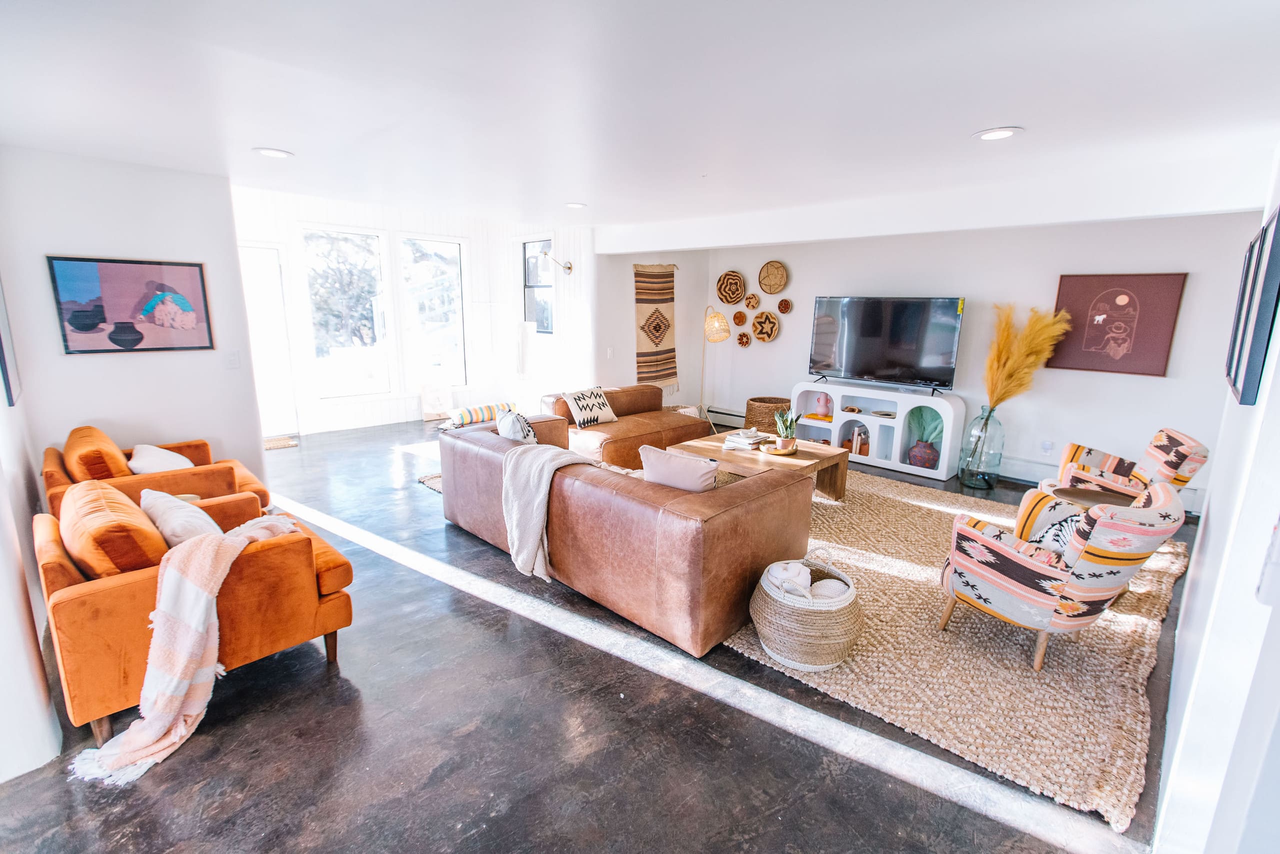 Downstairs lounge with big-screen TV and leather sectionals
