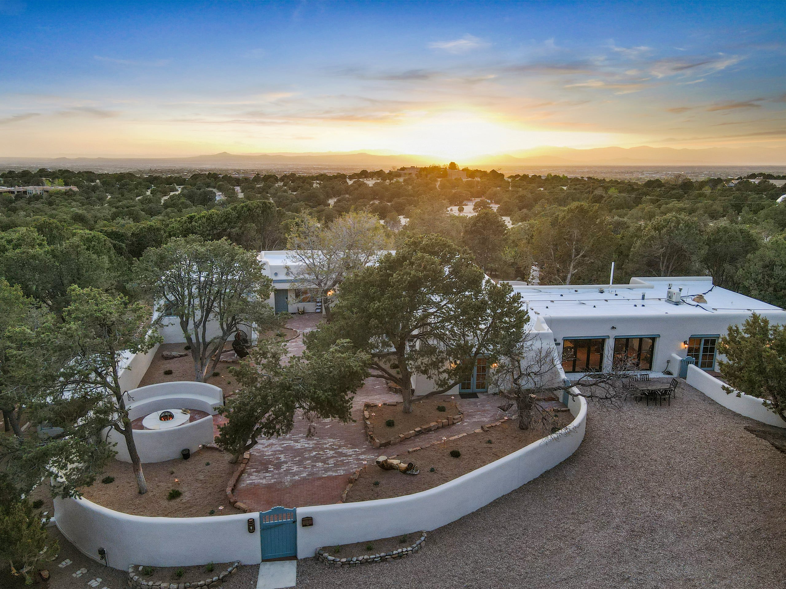 Aerial of the walled compound at sunset over the Santa Fe basin