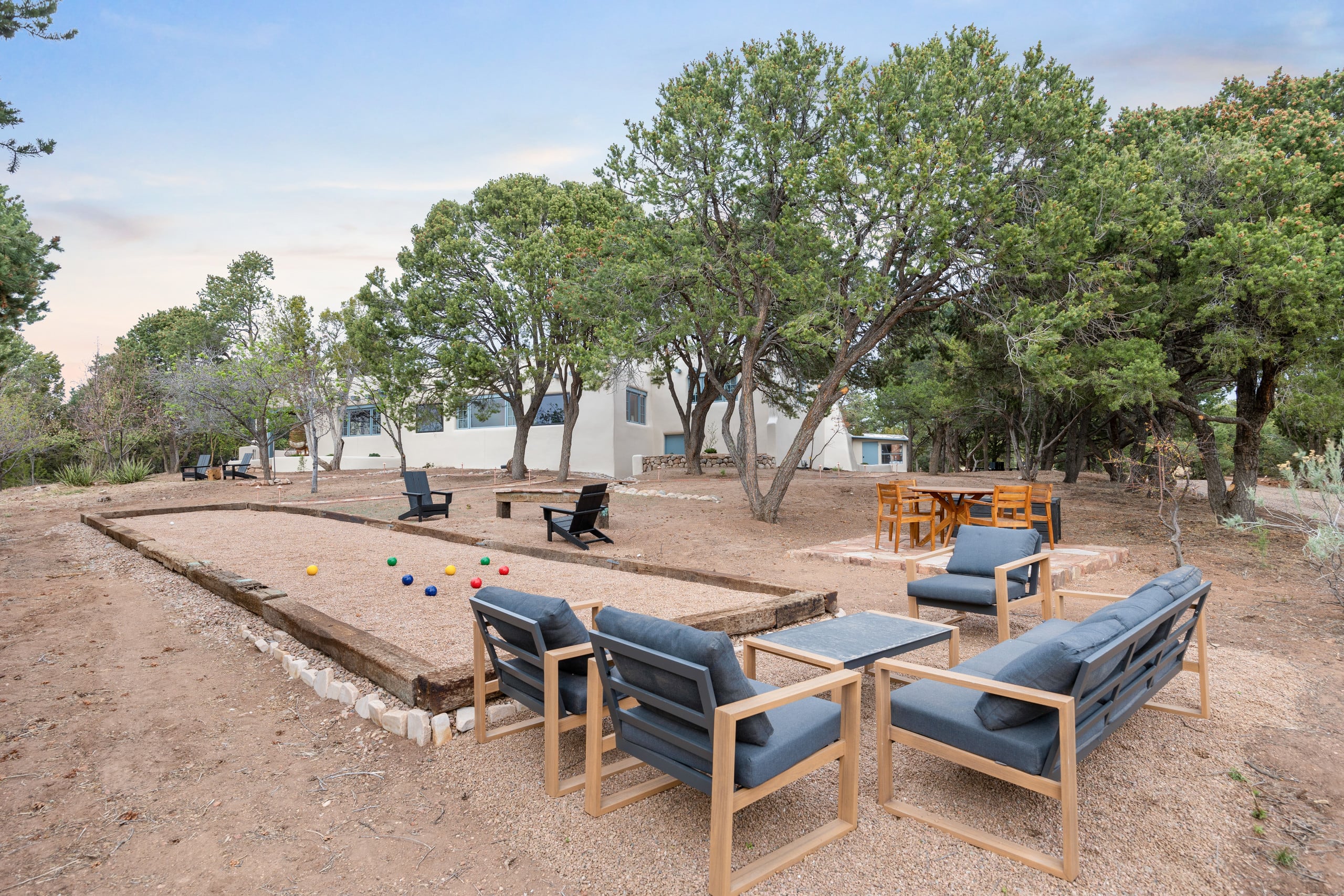 Bocce court with balls in play and lounge seating