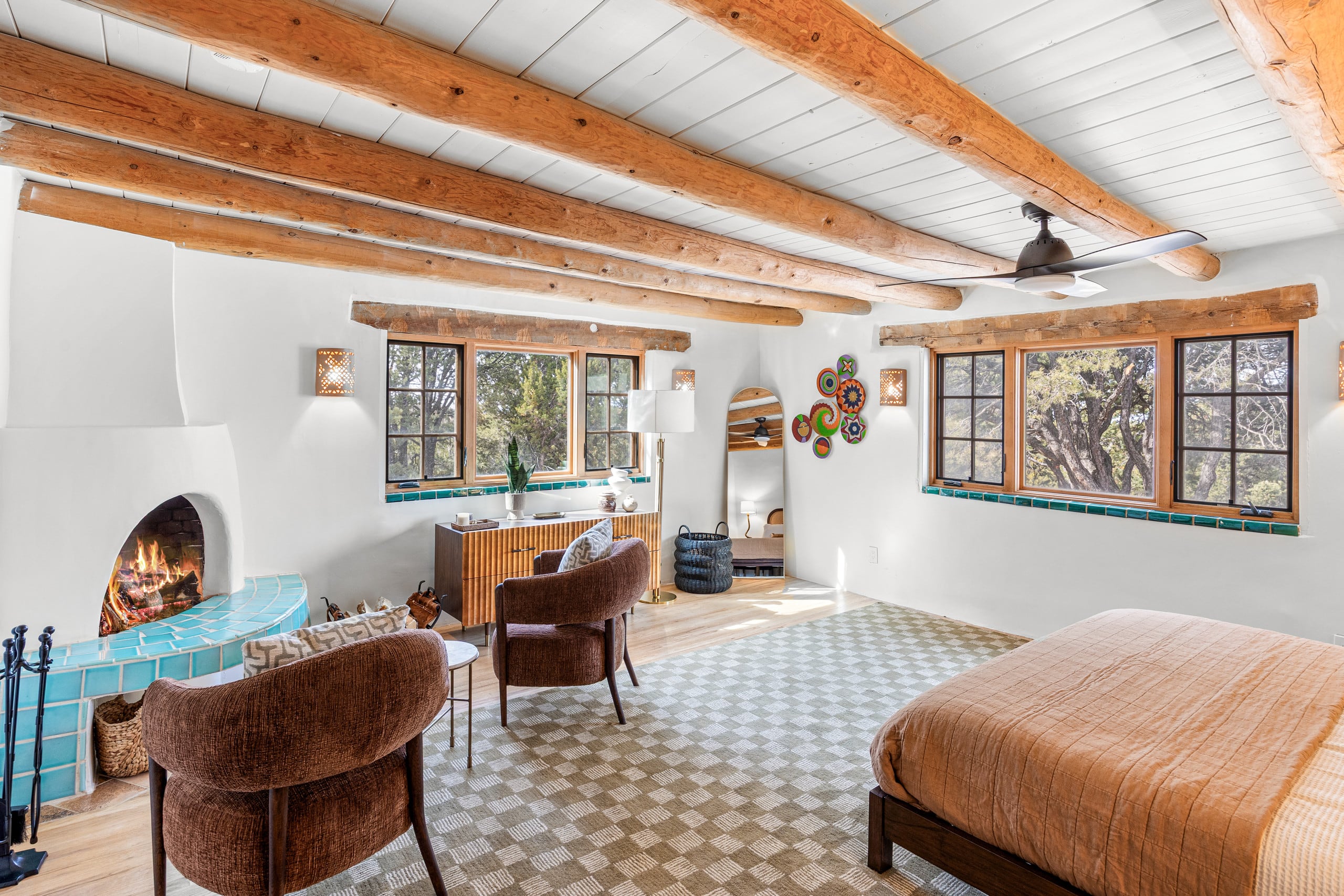 Primary king suite with lit corner kiva and sitting area